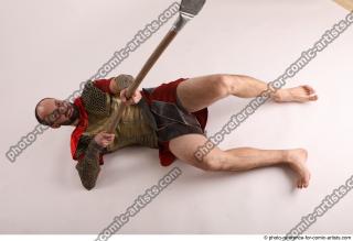MARCUS LAYING POSE WITH SPEAR